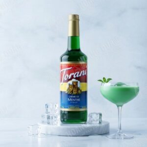 Green cocktail with mint garnish