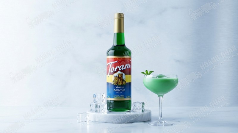 Green cocktail with mint garnish