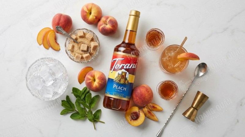 Peach syrup and iced drink display